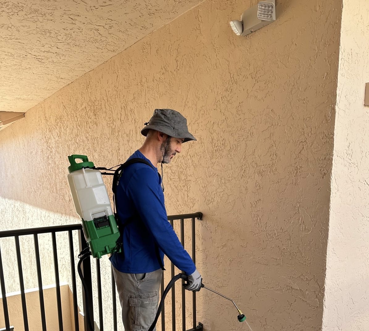 Professional pest control technician applying treatment in Coconut Creek